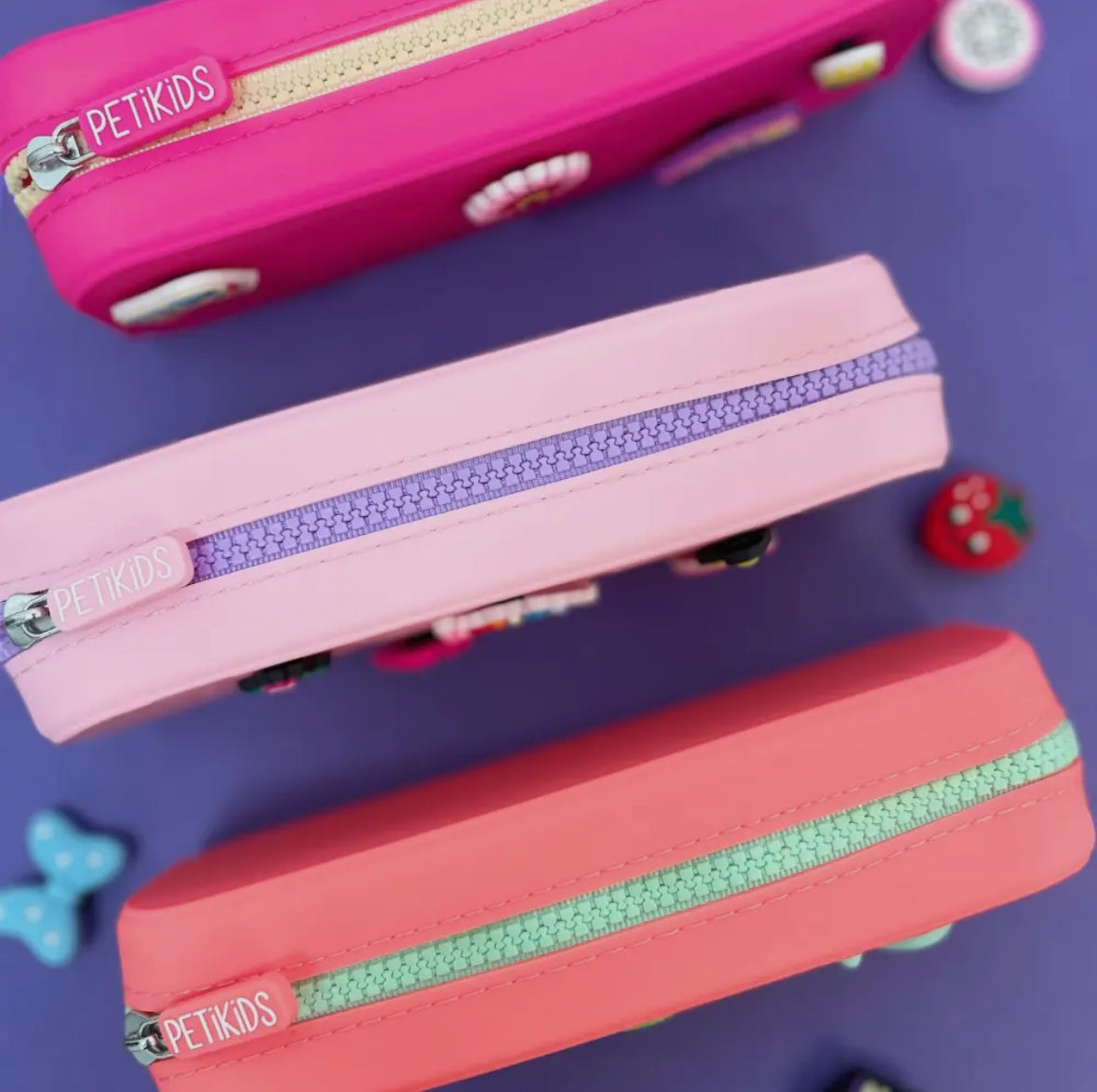 trousses scolaire Perforées+3 Charms 
PETIKIDS